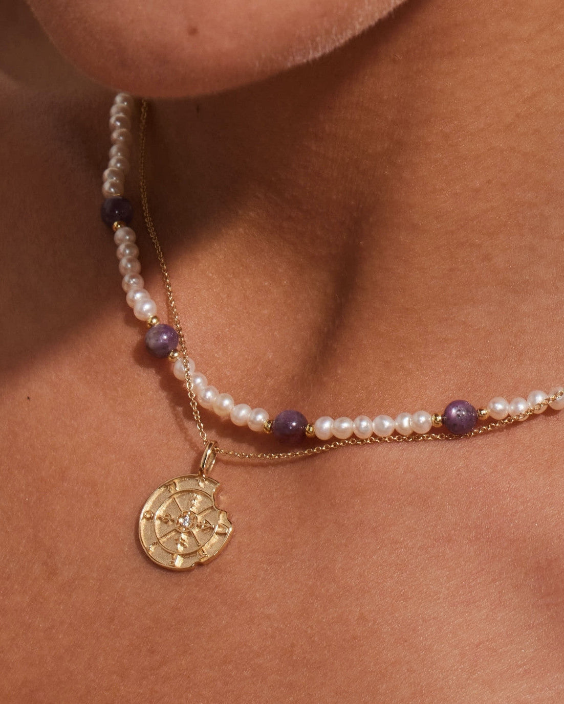 14K gold round medallion pendant on pearl and purple beaded necklace